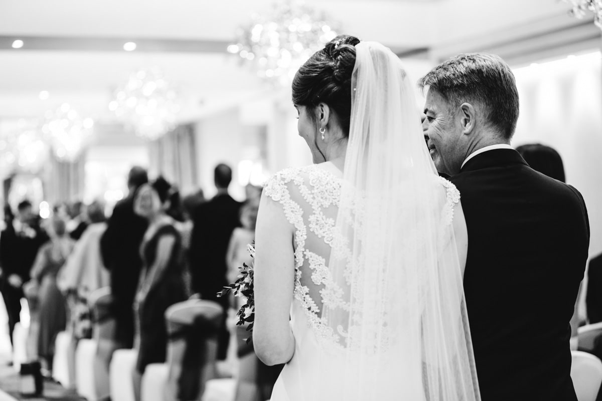 bride and her dad walking down the aisle at thornton hall hotel