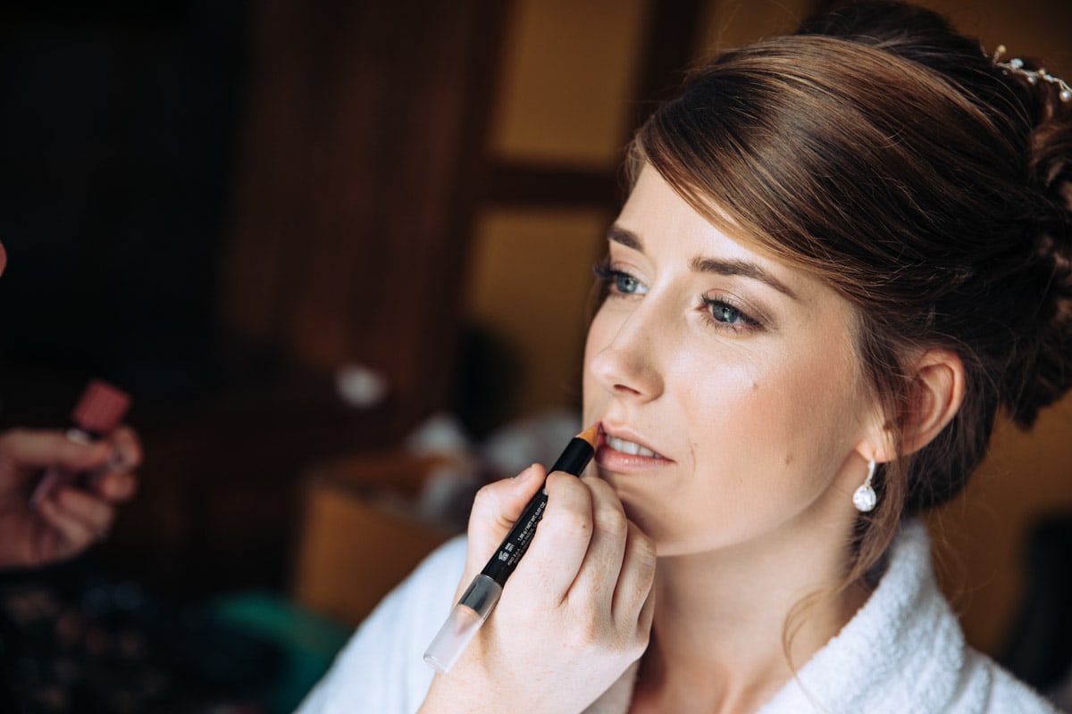 bride getting on makeup at thornton hall hotel