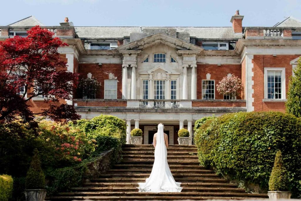 bride and groom portraits in the gardens at eaves hall lancashire