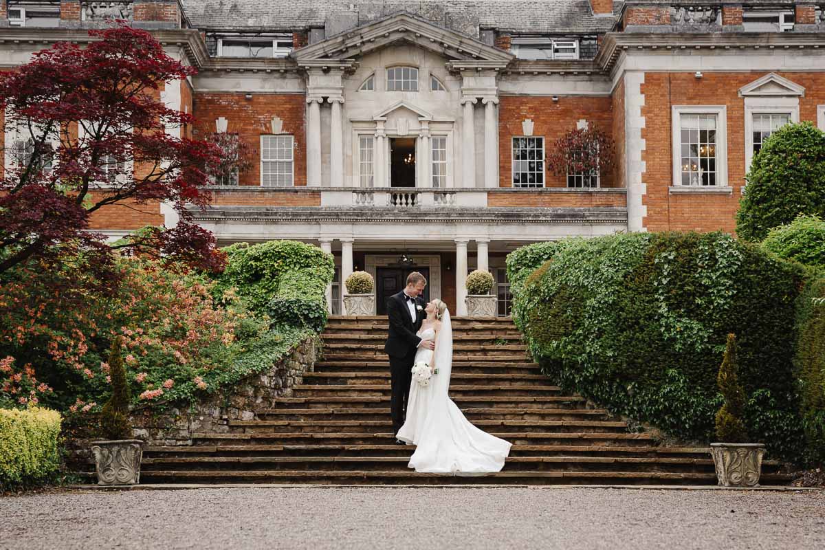 Bride and groom outside Eaves Hall Wedding Venue