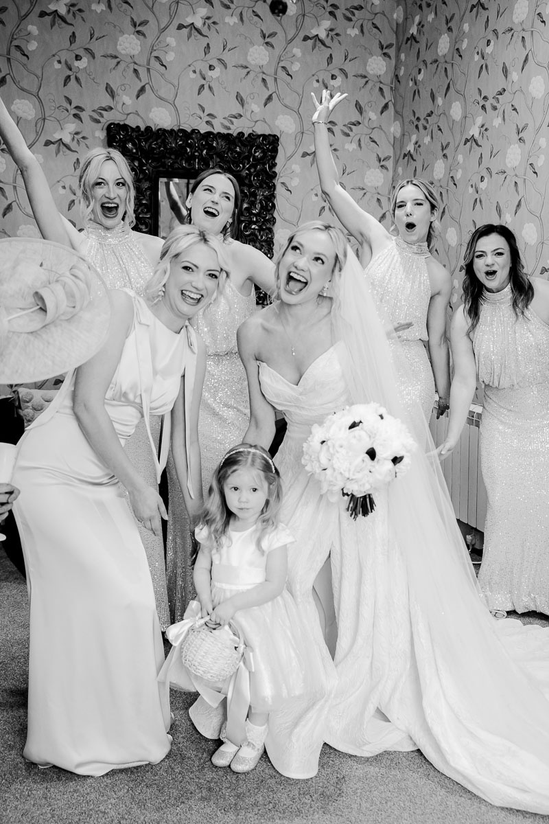 Guests celebrating on the lawn at Eaves Hall Wedding Venue