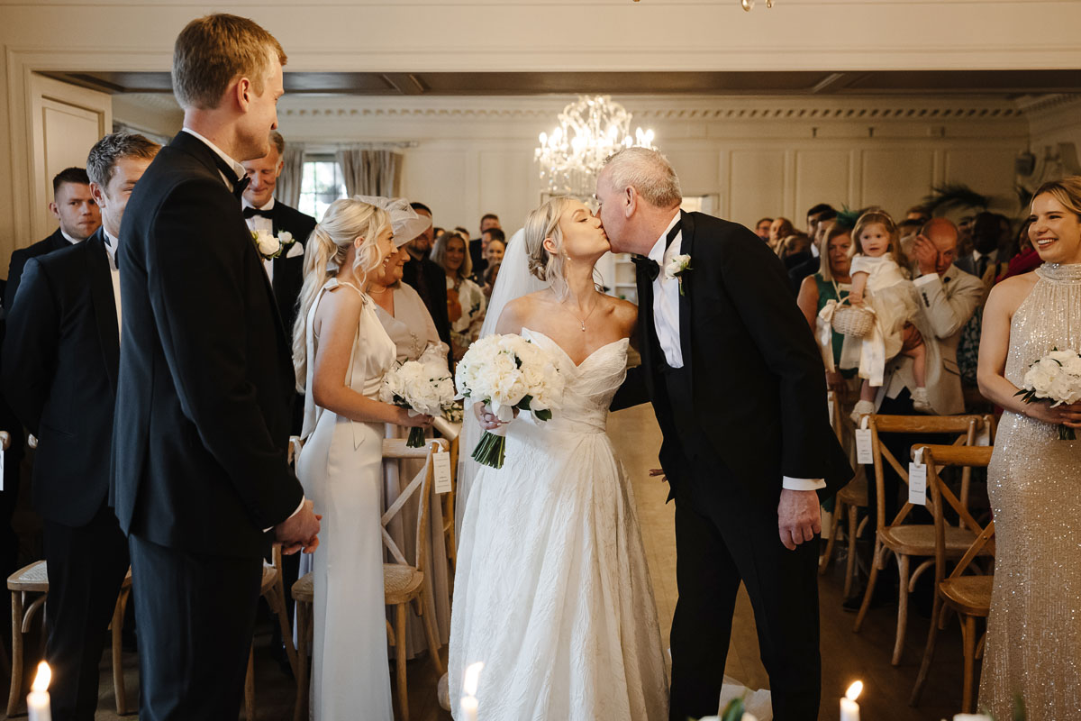 Guests celebrating on the lawn at Eaves Hall Wedding Venue