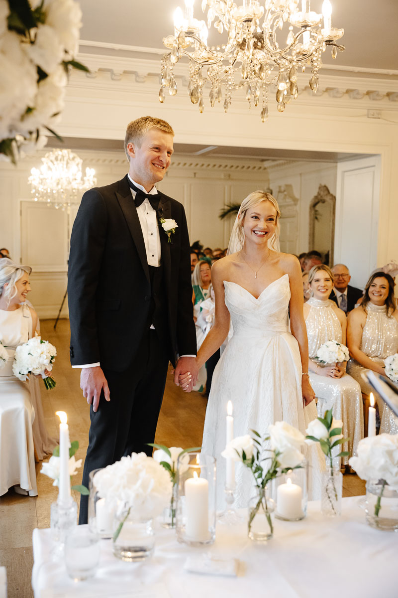 Guests celebrating on the lawn at Eaves Hall Wedding Venue